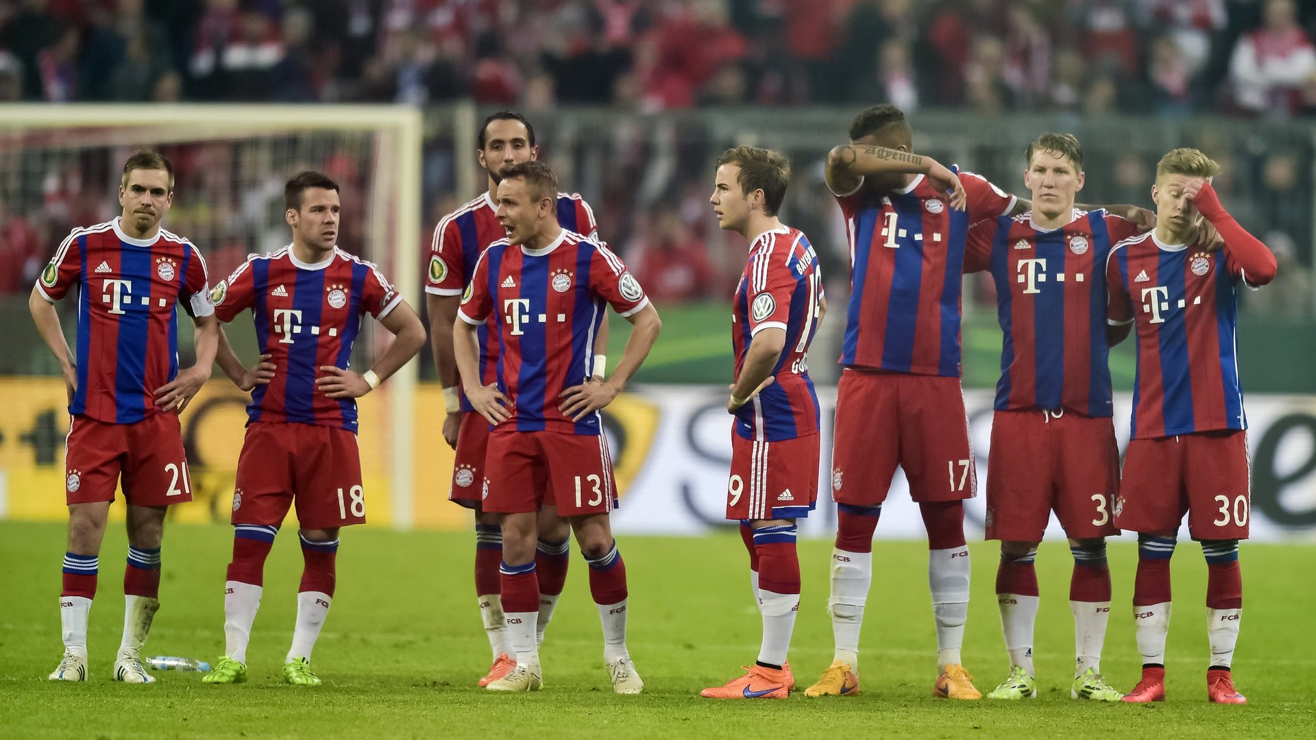 Bayern Munich's players react during the penalty shoot-out of the German Cup DFB Pokal semi-final football match FC Bayern Munich v Borussia Dortmund in Munich, southern Germany, on April 28, 2015. Dortmund won the match 1-3 after penalties. AFP PHOTO / GUENTER SCHIFFMANN +++ RESTRICTIONS / EMBARGO ACCORDING TO DFB RULES IMAGE SEQUENCES TO SIMULATE VIDEO IS NOT ALLOWED DURING MATCH TIME. MOBILE (MMS) USE IS NOT ALLOWED DURING AND FOR FURTHER TWO HOURS AFTER THE MATCH. FOR MORE INFORMATION CONTACT DFB DIRECTLY AT +49 69 67880 (Photo credit should read GUENTER SCHIFFMANN/AFP/Getty Images)